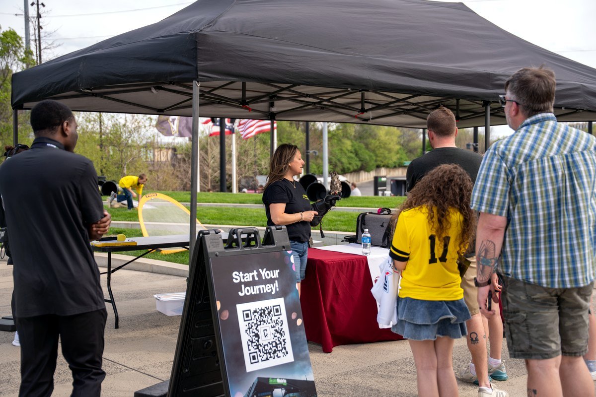 Ohio School of Falconry booth with Columbus Crew fans