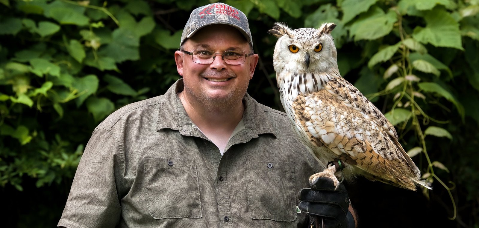 Ohio School of Falconry educator with an ambassador raptor