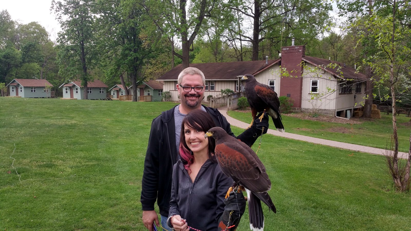 Ohio School of Falconry guests with ambassador hawks at a program location