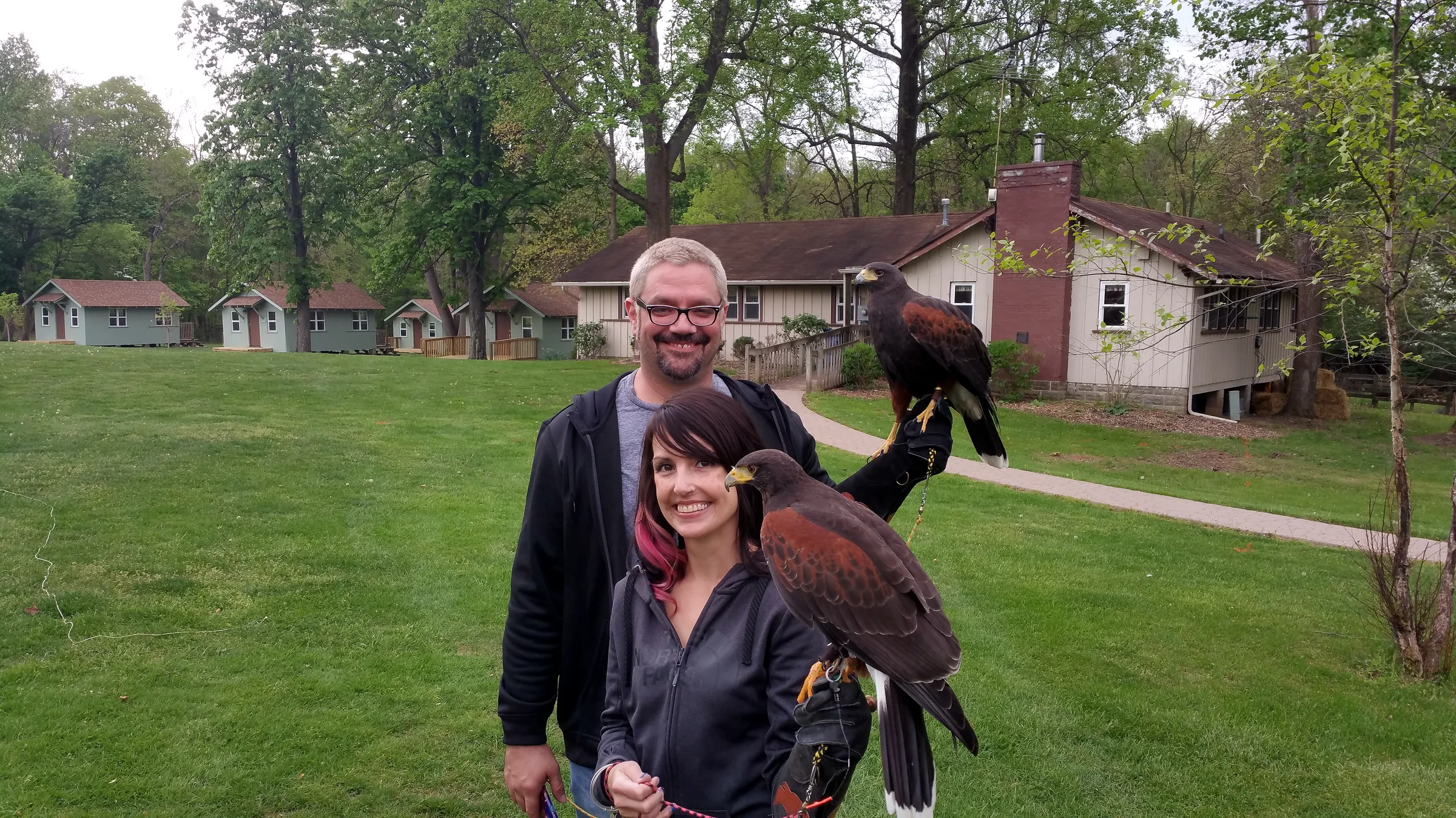 Ohio School of Falconry guests with ambassador hawks at a program site