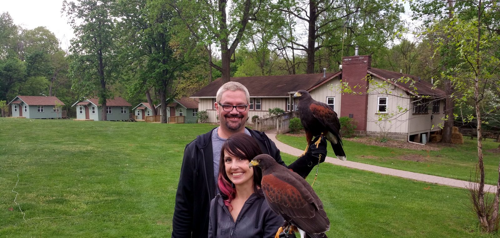 Ohio School of Falconry guests with ambassador hawks at a program location